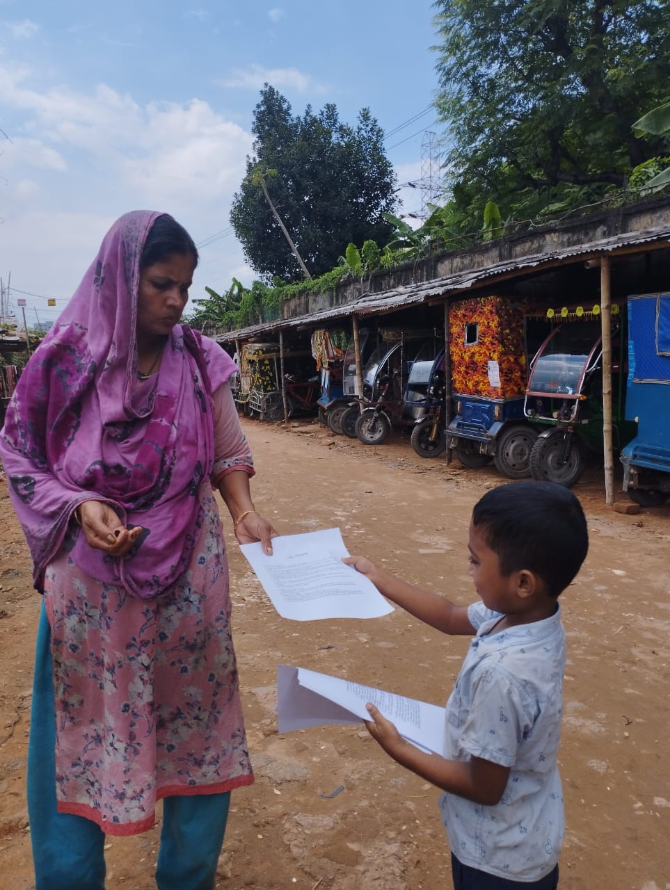 Rifat handing out documents for Diarrhea Awareness