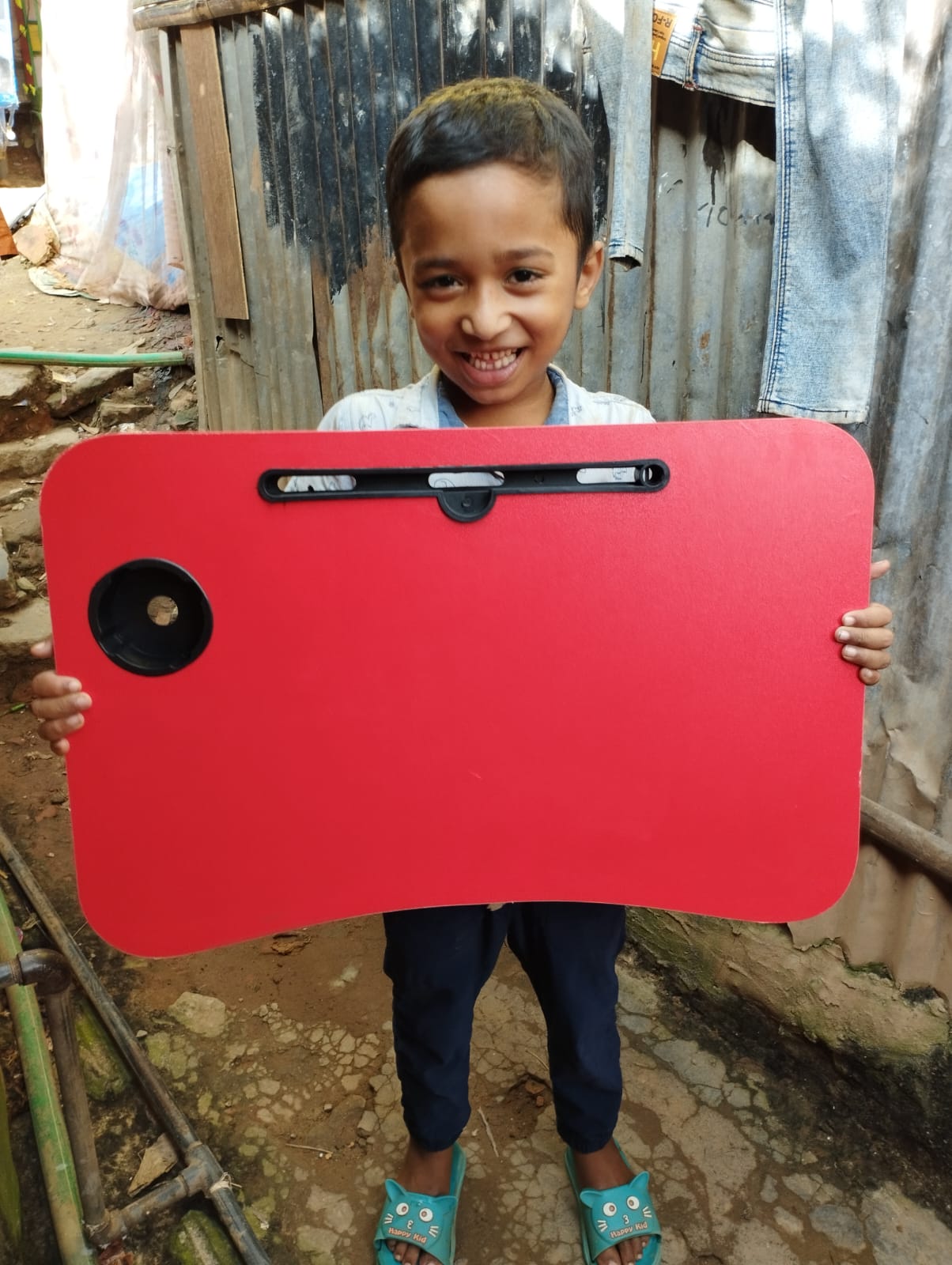 Rifat receiving a study desk